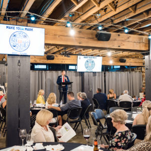 Attendees from previous Make Your Mark on Mental Health Gala listen to Lost&Found Executive Director, Erik Muckey, speaking about need for financial support of youth and young adult suicide prevention programs.